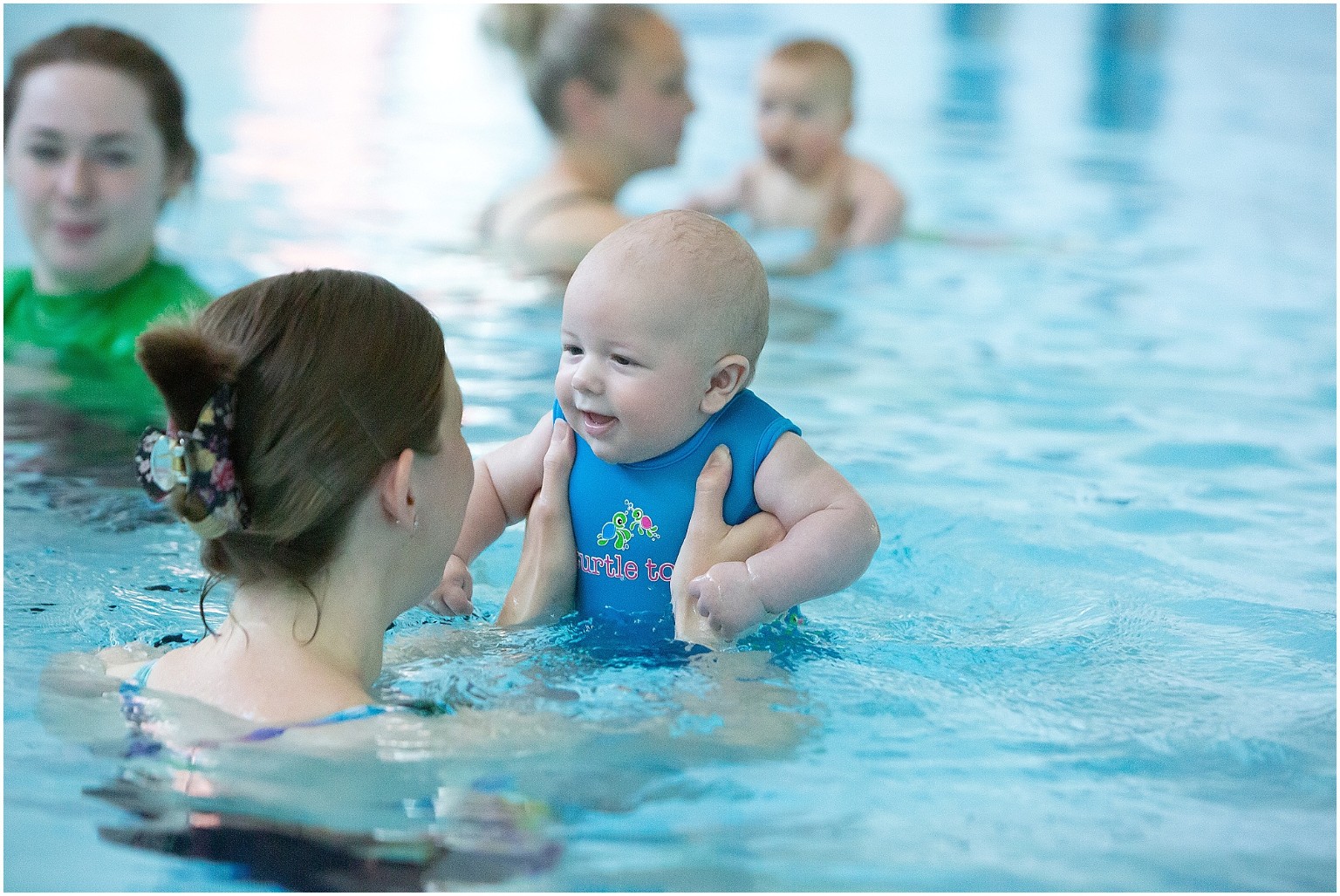 Parent and baby enjoying a swim lesson