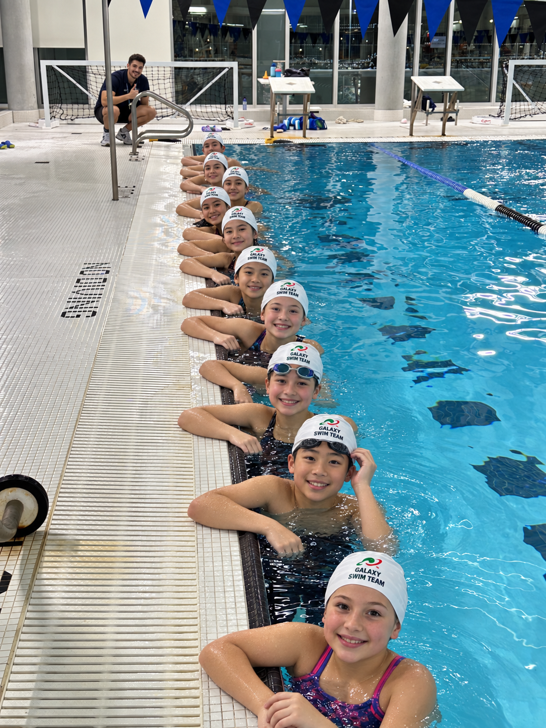 Fictional Galaxy Swim Team children attending a swim lesson